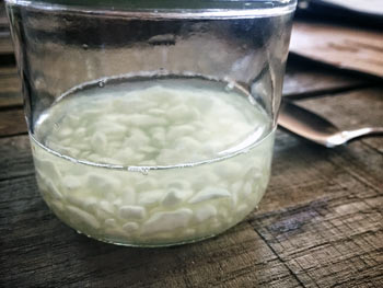 Cheese curds in a jar of clear liquid